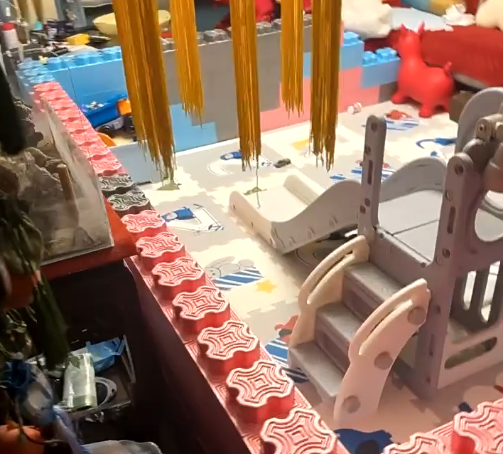 A small fence made of pink building blocks