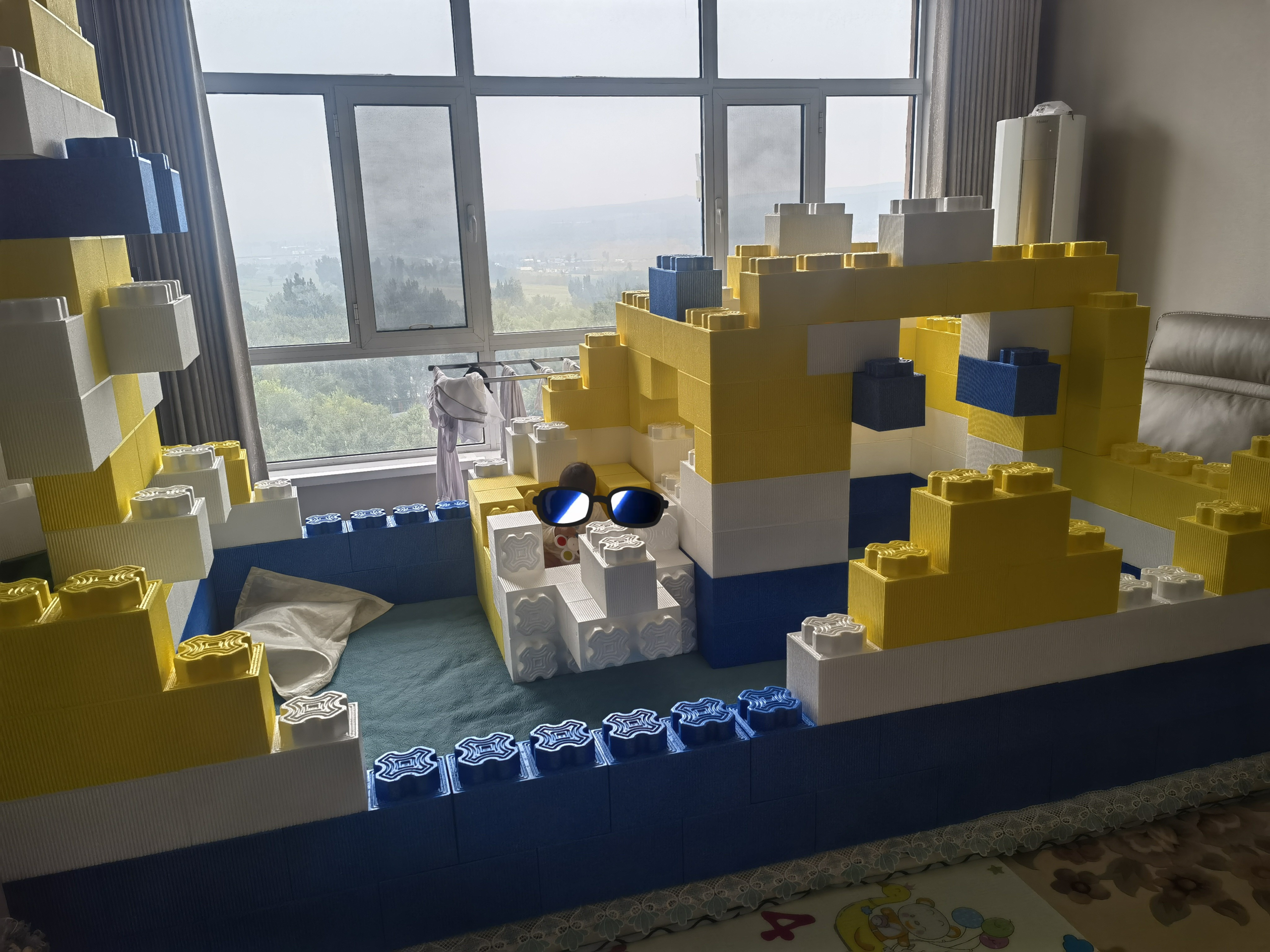 A castle constructed with yellow, blue, and white building blocks
